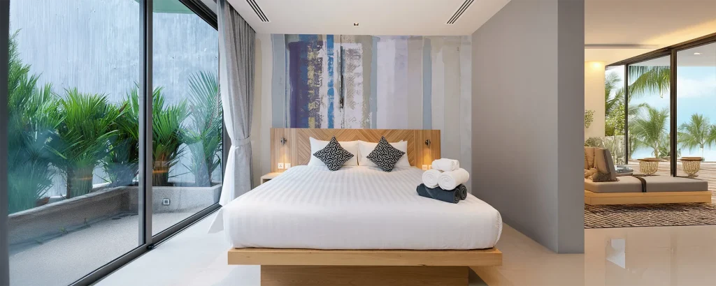Hotel resort bedroom with custom wallcovering behind the bed.