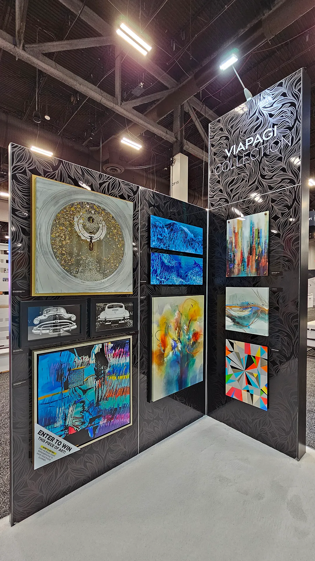 Viapagi Collection art display featuring contemporary abstract artwork, multi-panel prints, and curated designer pieces at the Image Craft trade show booth.