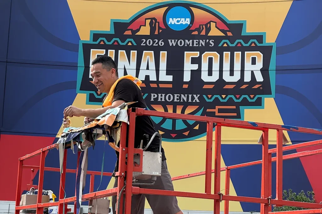 Image Craft installer applying large-format graphics for the 2026 NCAA Women’s Final Four in Phoenix