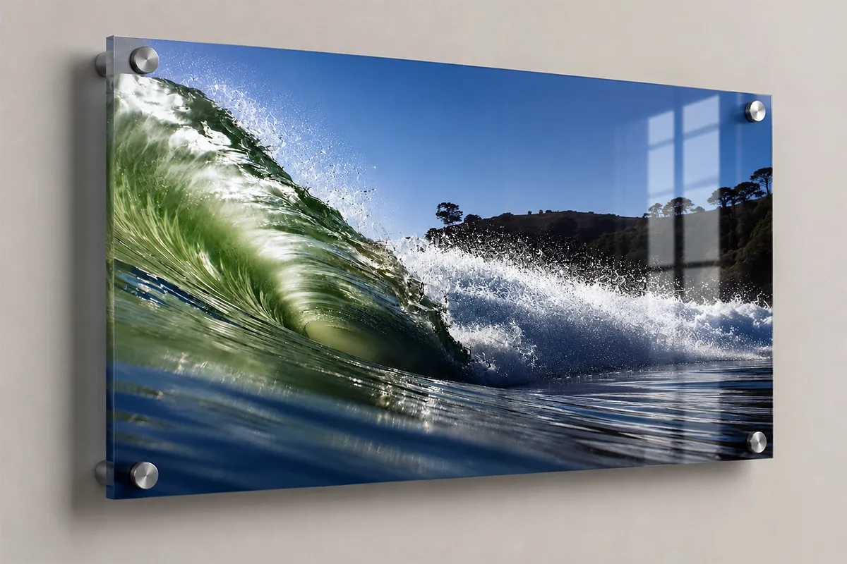Close-up acrylic photo print of an ocean wave mounted with brushed metal standoffs