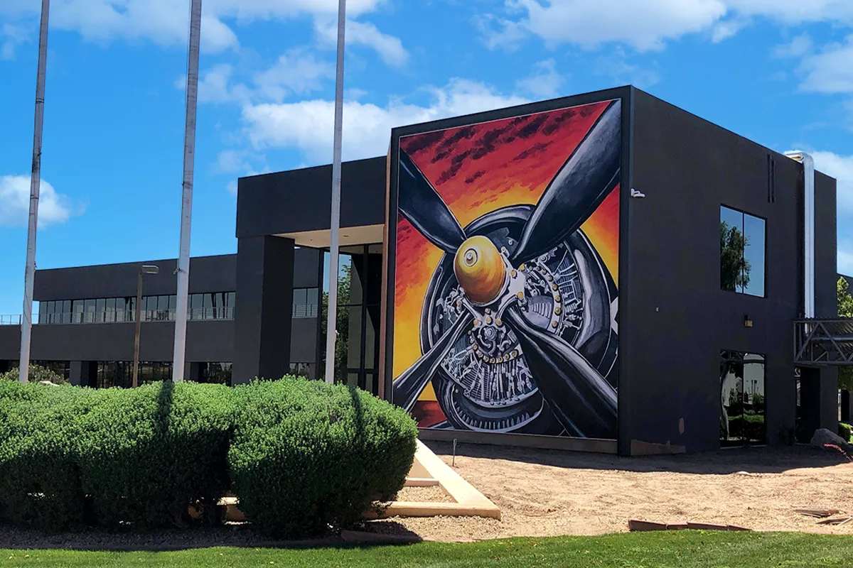 Large exterior airplane propeller wall graphic installed on a commercial building