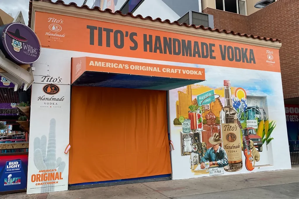 Tito’s Handmade Vodka branded exterior wall mural installed on a commercial building