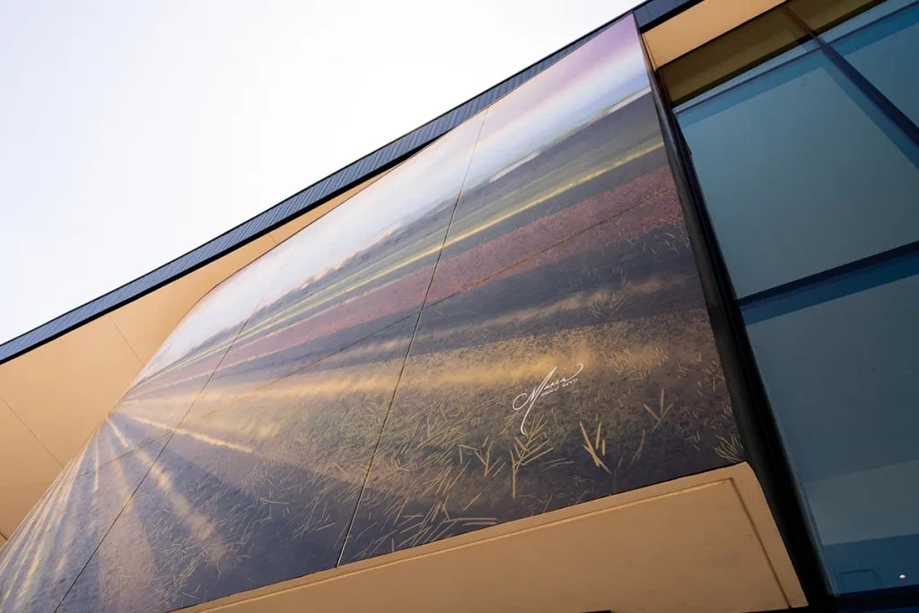 Large-format exterior wall graphics integrated into the Tolleson Community Center building facade